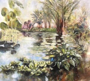 Lapset istuvat rauhallisen lammen äärellä trooppisten kasvien keskellä.