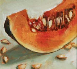 Kurpitsan maalaus siemenillä pöydällä