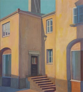 Auringonpaisteinen seinä ja portaat kaupunkimaisemassa