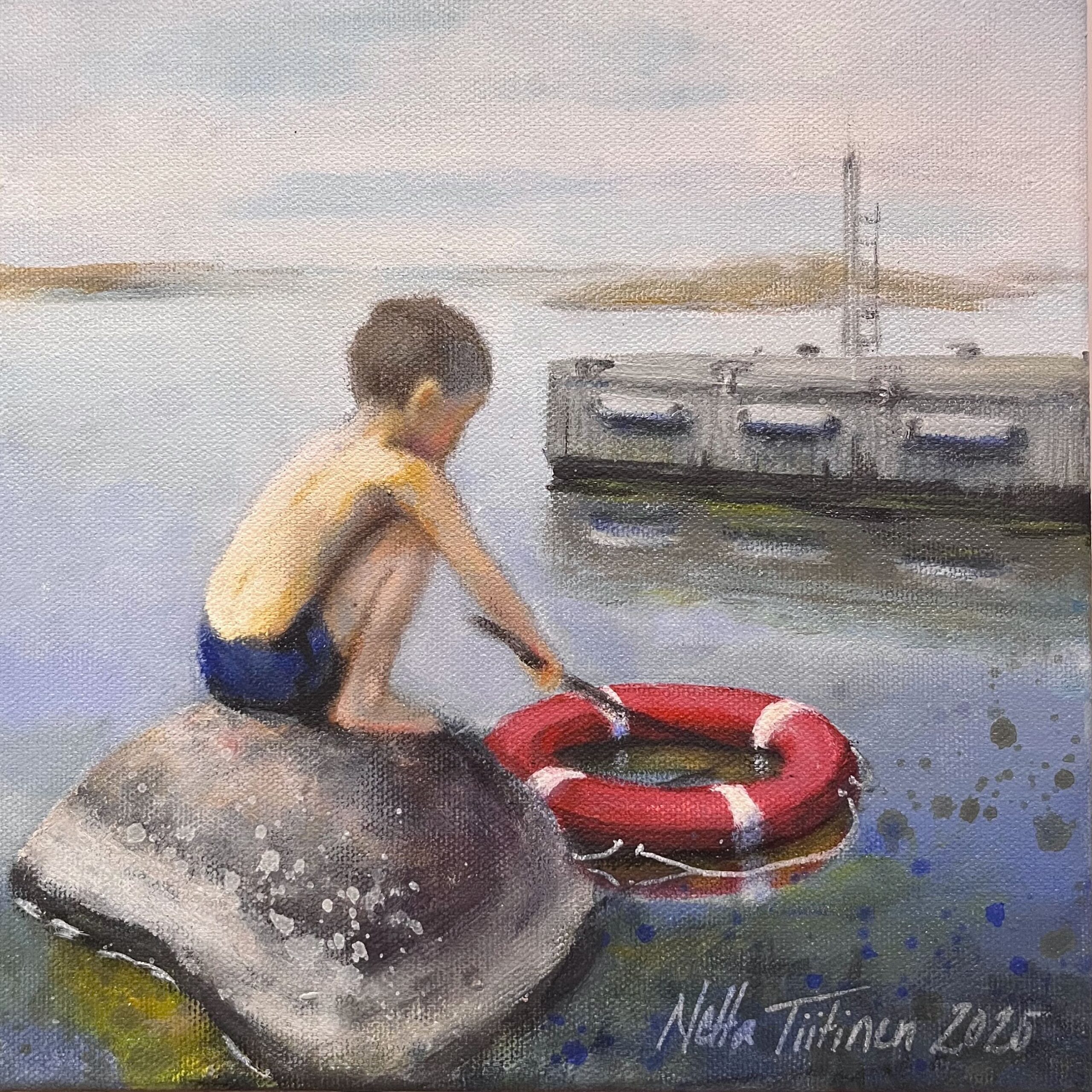 Poika kivellä ja pelastusrengas vedessä