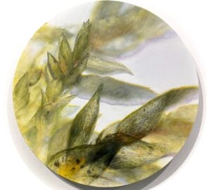 Abstrakti kasviaiheinen maalaus pyöreässä muodossa.